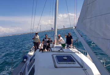 Boat tour with aperitif and sailing lesson near Pisa