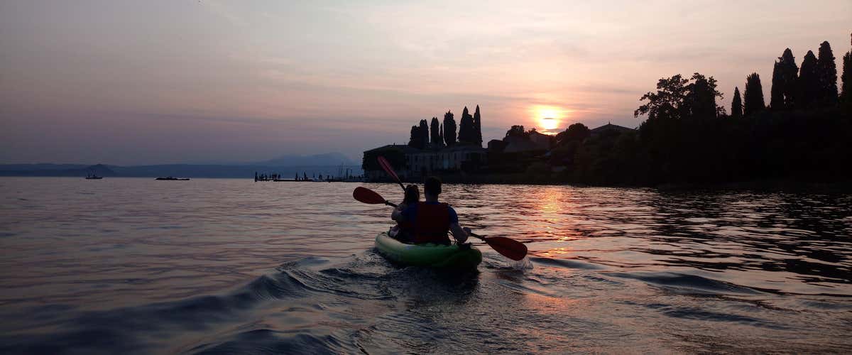 Canoe trip on Lake Garda at sunset