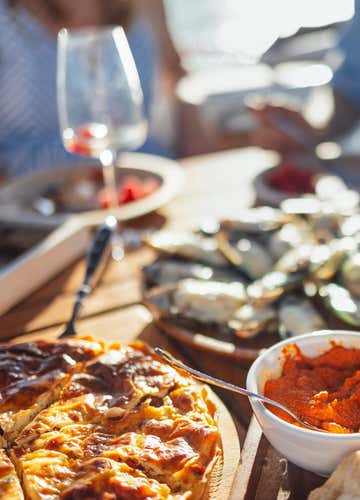 Dinghy sunset tour on the Riviera dei Ciclopi with aperitif