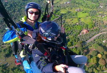 Tandem paragliding flight over the hills of Tivoli