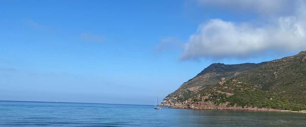 Horse riding on the Porto Ferro beach at sunset