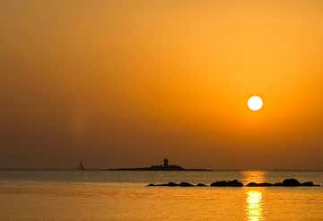 Sunset aperitif on a sailing boat in Alghero