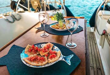 Sunset aperitif on a sailing boat in Alghero