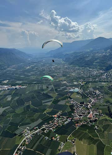 Tandem paragliding flight at Monte San Vigilio