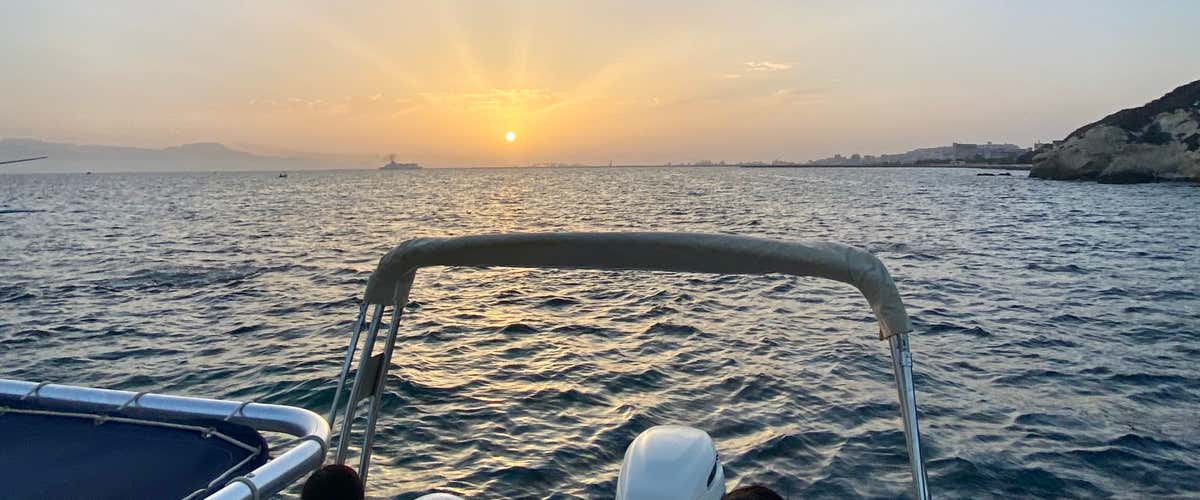 Dinghy aperitif at sunset in the Gulf of Angels