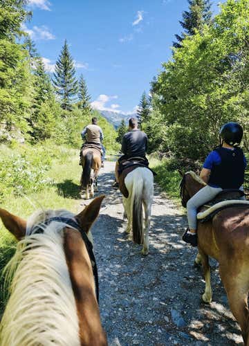 Summer horseback riding in the mountains of Valmalenco