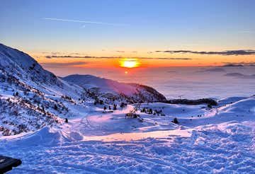 Giro in motoslitta e aperitivo con vista a Montecampione