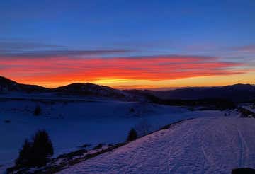 Ciaspolata a Montecampione in Valle Camonica al tramonto