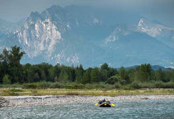 Winter rafting adventure on the Cordevole river in the Dolomites