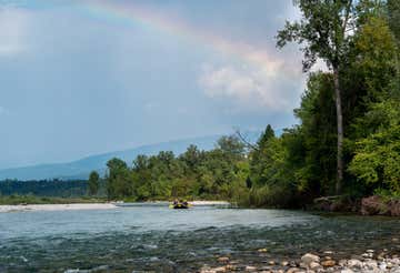 Winter rafting adventure on the Cordevole river in the Dolomites
