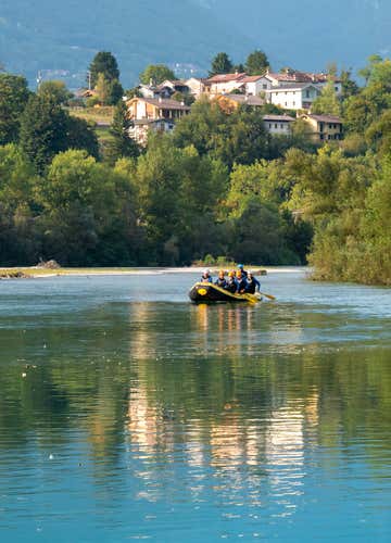 Winter rafting adventure on the Cordevole river in the Dolomites