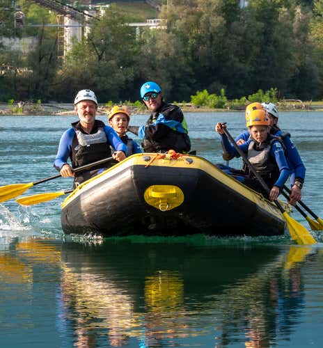 Winter rafting adventure on the Cordevole river in the Dolomites