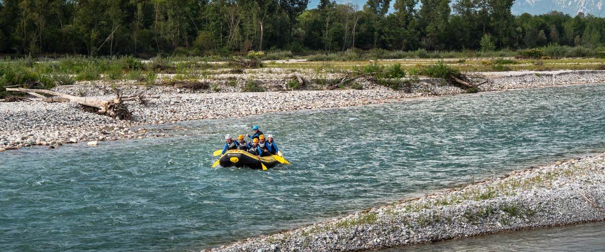 Winter rafting adventure on the Cordevole river in the Dolomites
