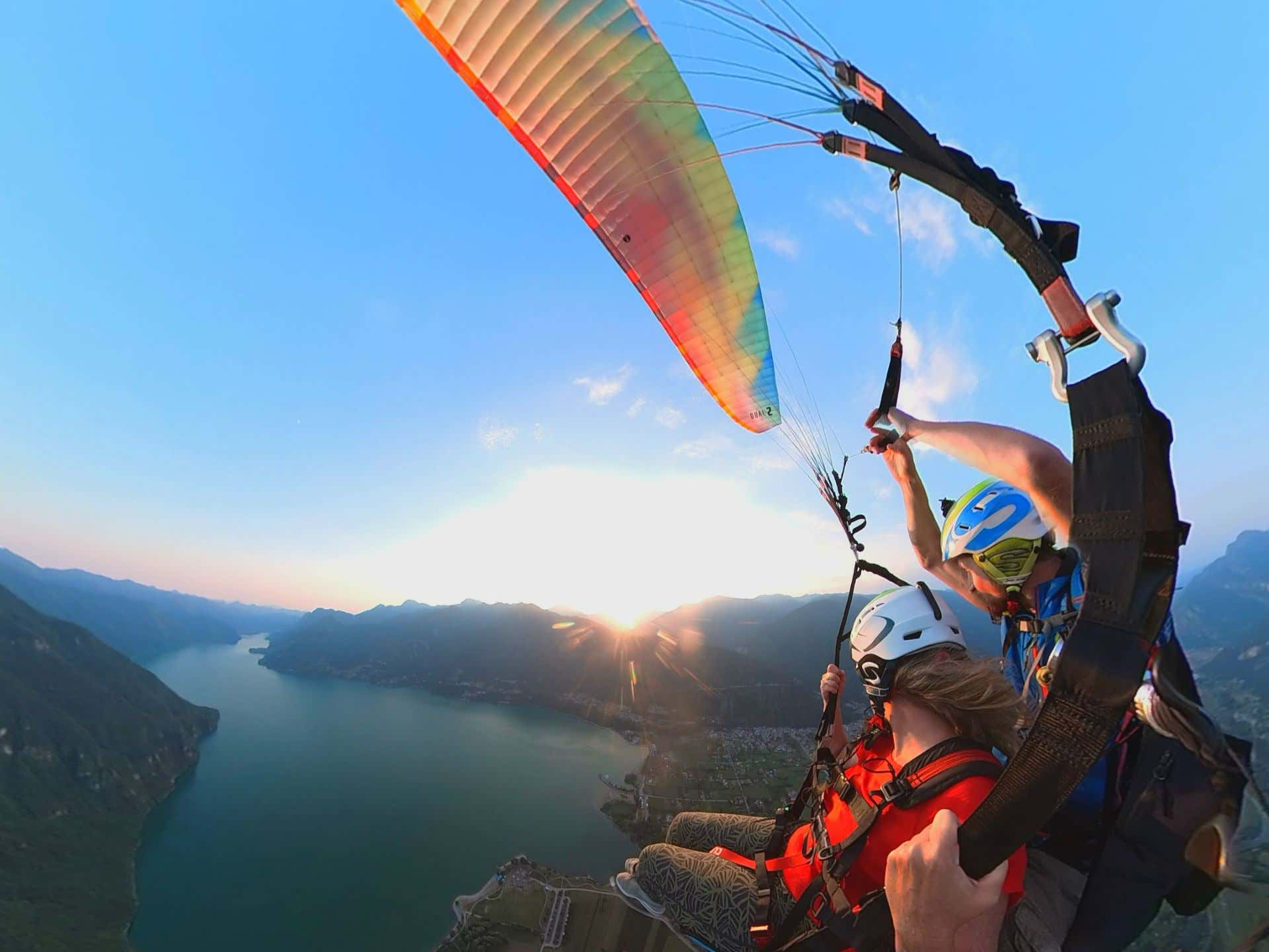 Acrobatic paragliding flight over Lake Idro